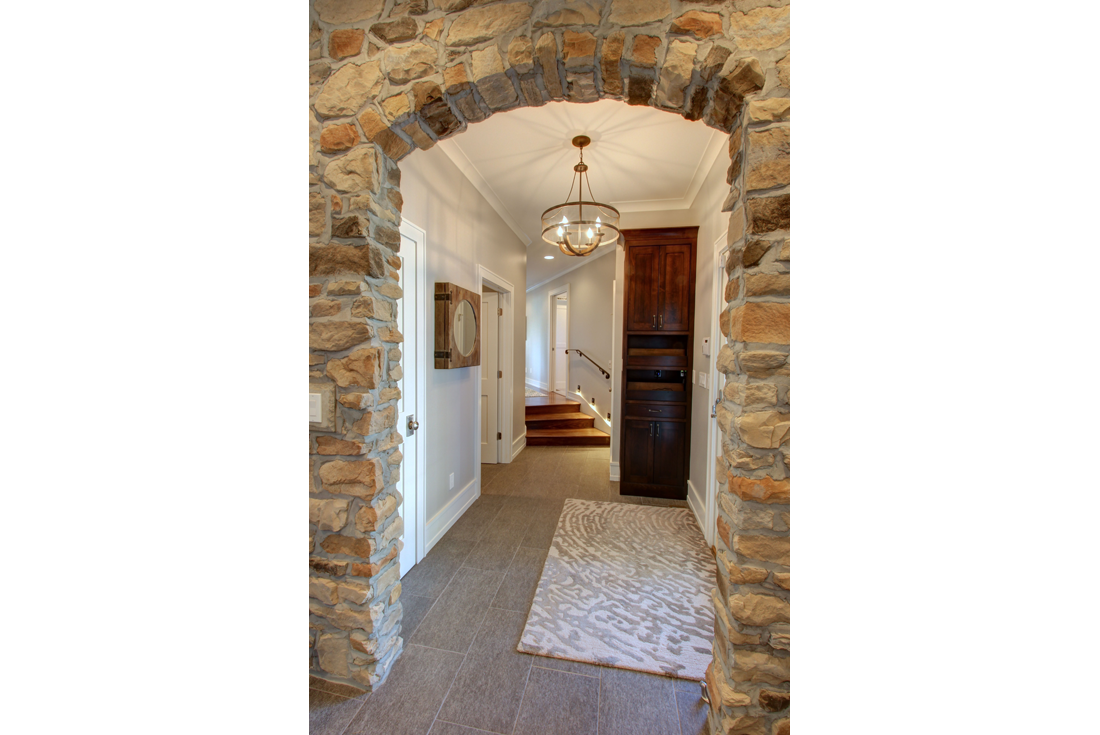 farmhouse remodel addition stone arch