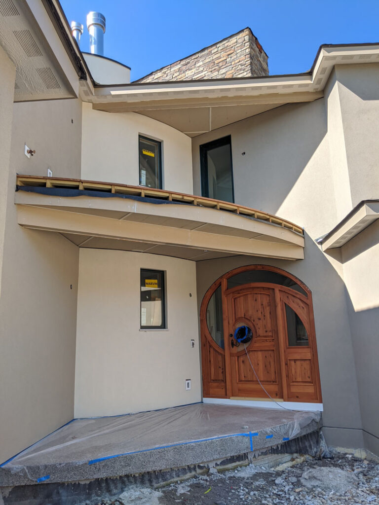 custom entry door exposed aggregate porch