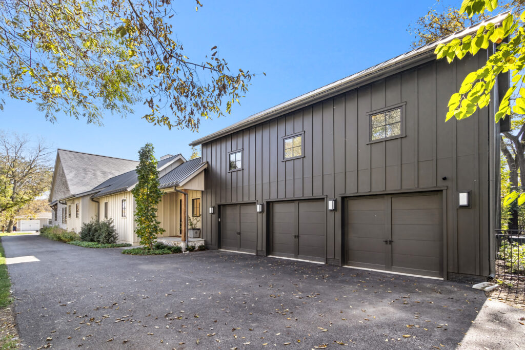 custom home massing black siding garage