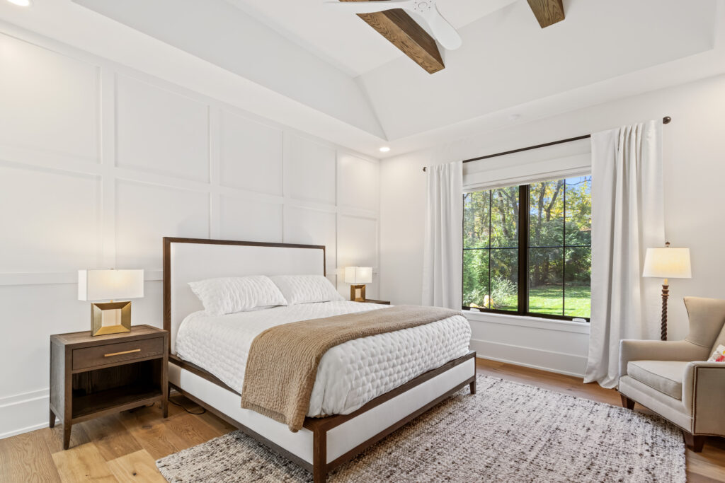 master primary bedroom rustic beams wood floor