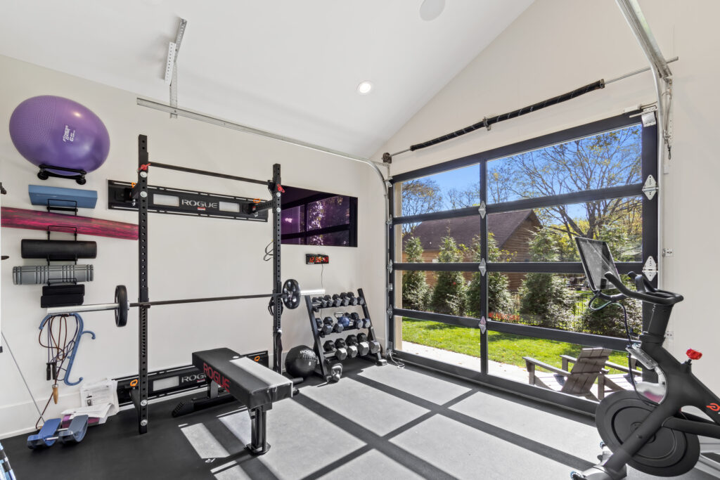 custom home exercise room glass garage door